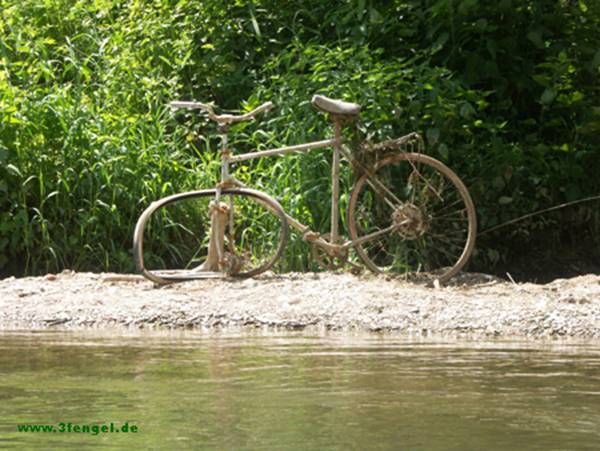bicycle wreck on a sandbank at river Necker, Germany