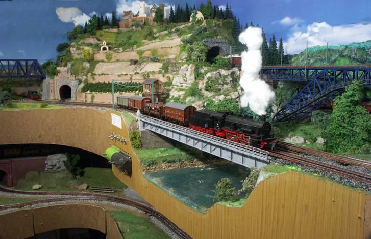 panrama view on the neckar with the lower neckar bridge, the Motzberg hill and engine 55 on the bridge with a local freight train