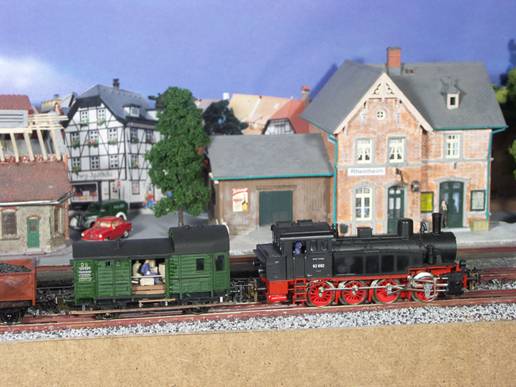 engine 92 with a local freight and a freen MRE Caboose on track 3 in Rheinheim station